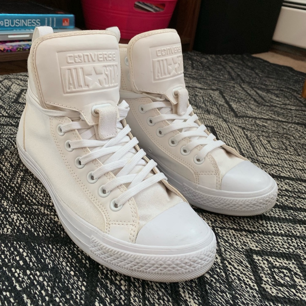 White Converse high-tops.
